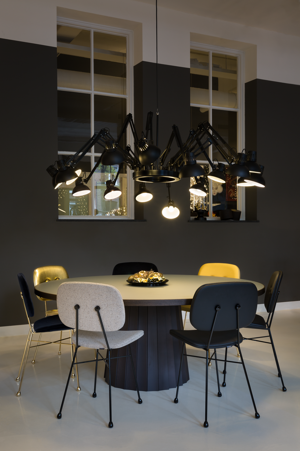 Interior of Amsterdam Showroom 2018 with Dear Ingo suspension light, The Golden Chair and Container Table