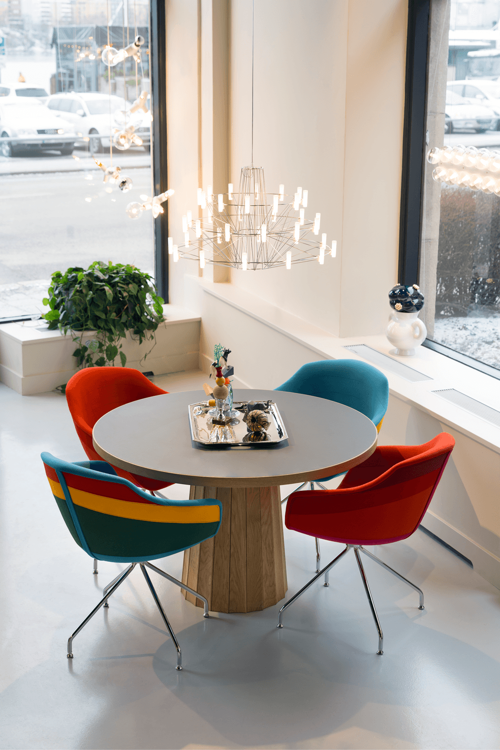 Moooi Canal Chairs in different fabrics with steel legs, Container Table, Coppélia and Delft Blue Vase No7.