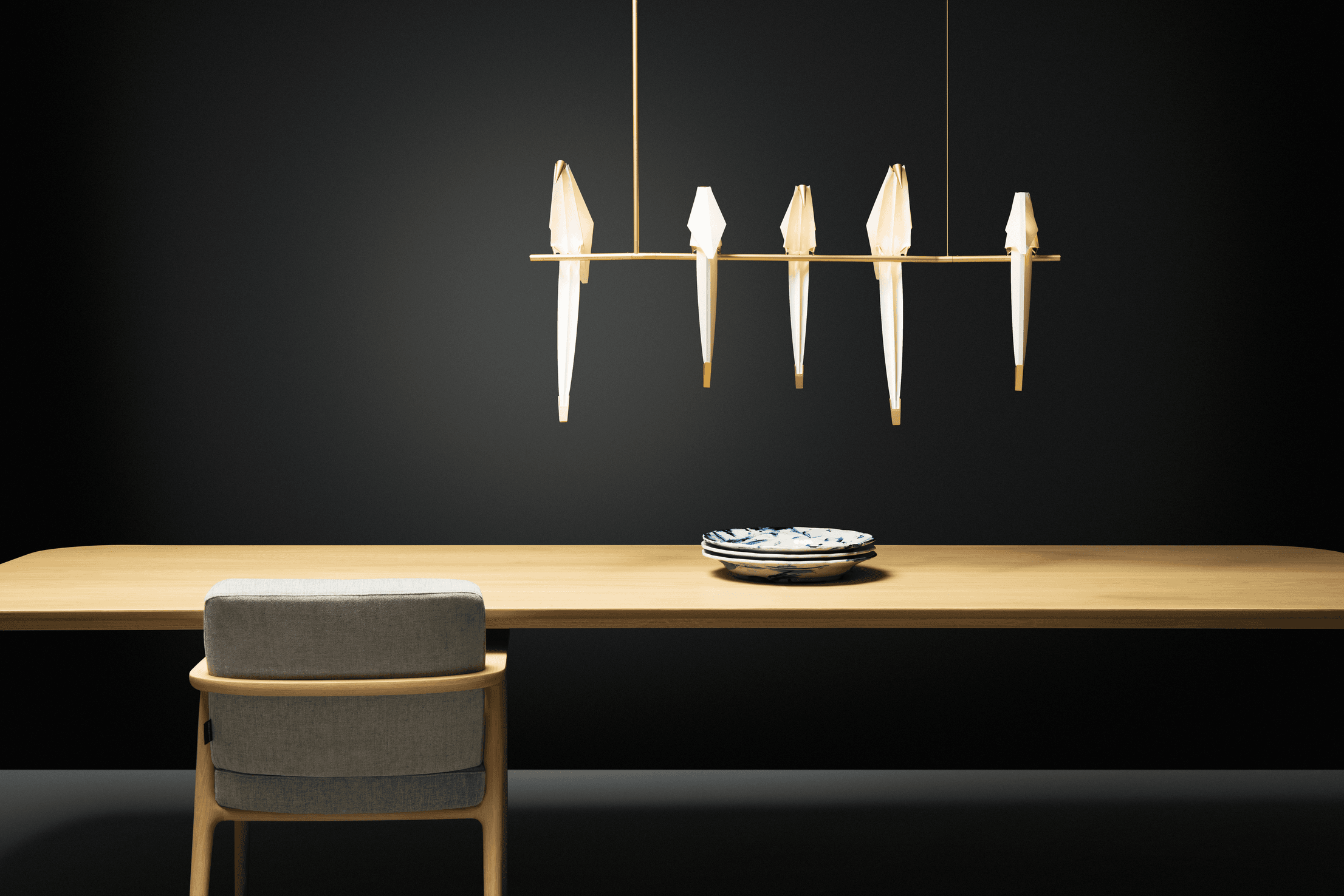 Perch Light Branch above dining table with black background