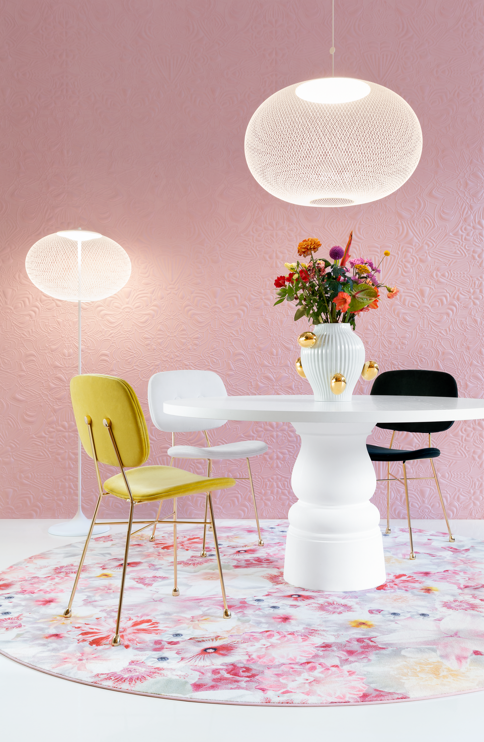 Flowergarden carpet in setting with golden chairs and container table and moooi wallcovering 