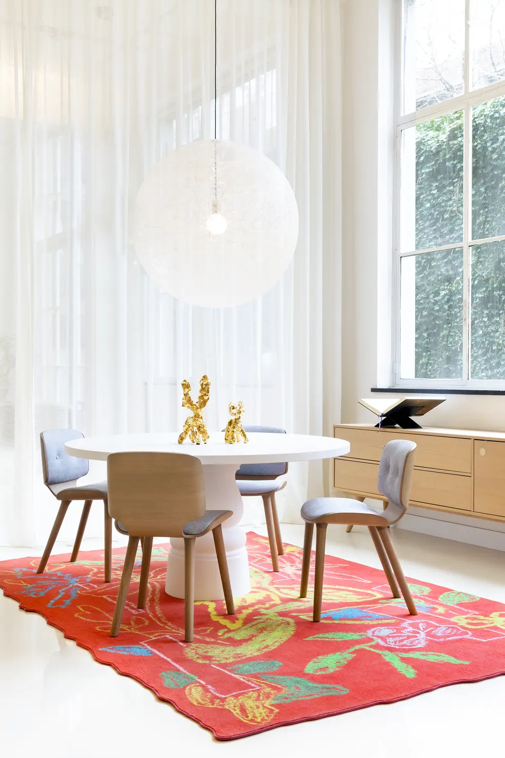 interior setting with container table and random light and nut dining chairs