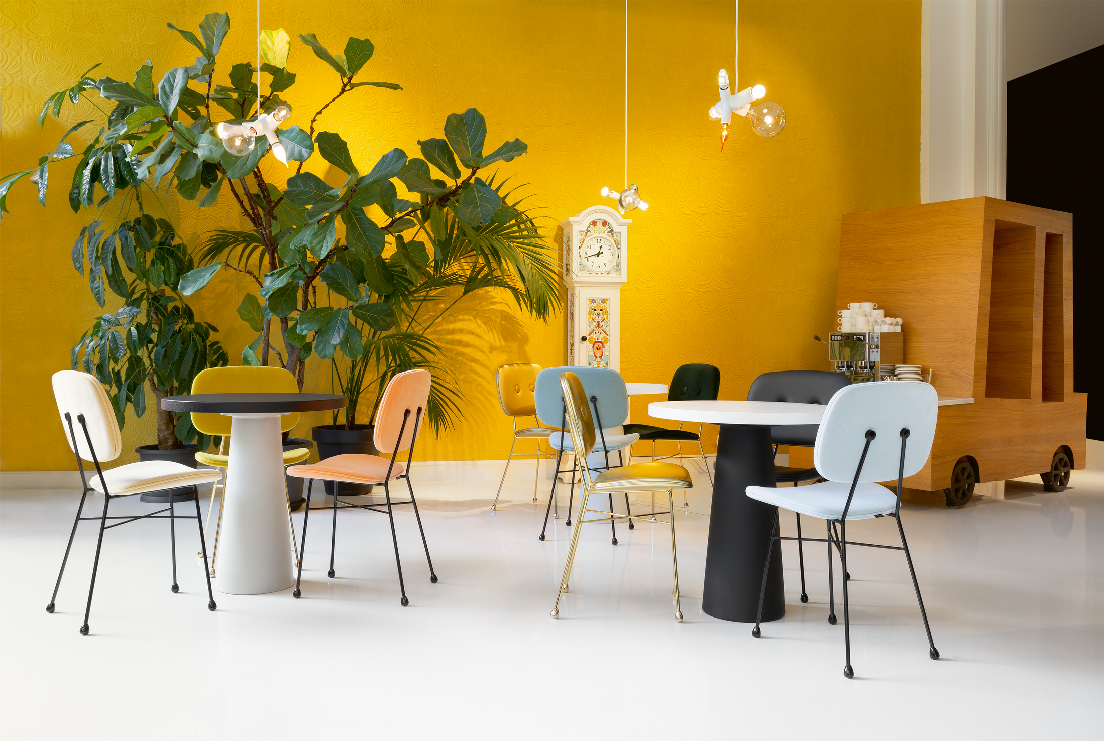 moooi container tables classic cafe setting with cluster lamp and the golden chairs