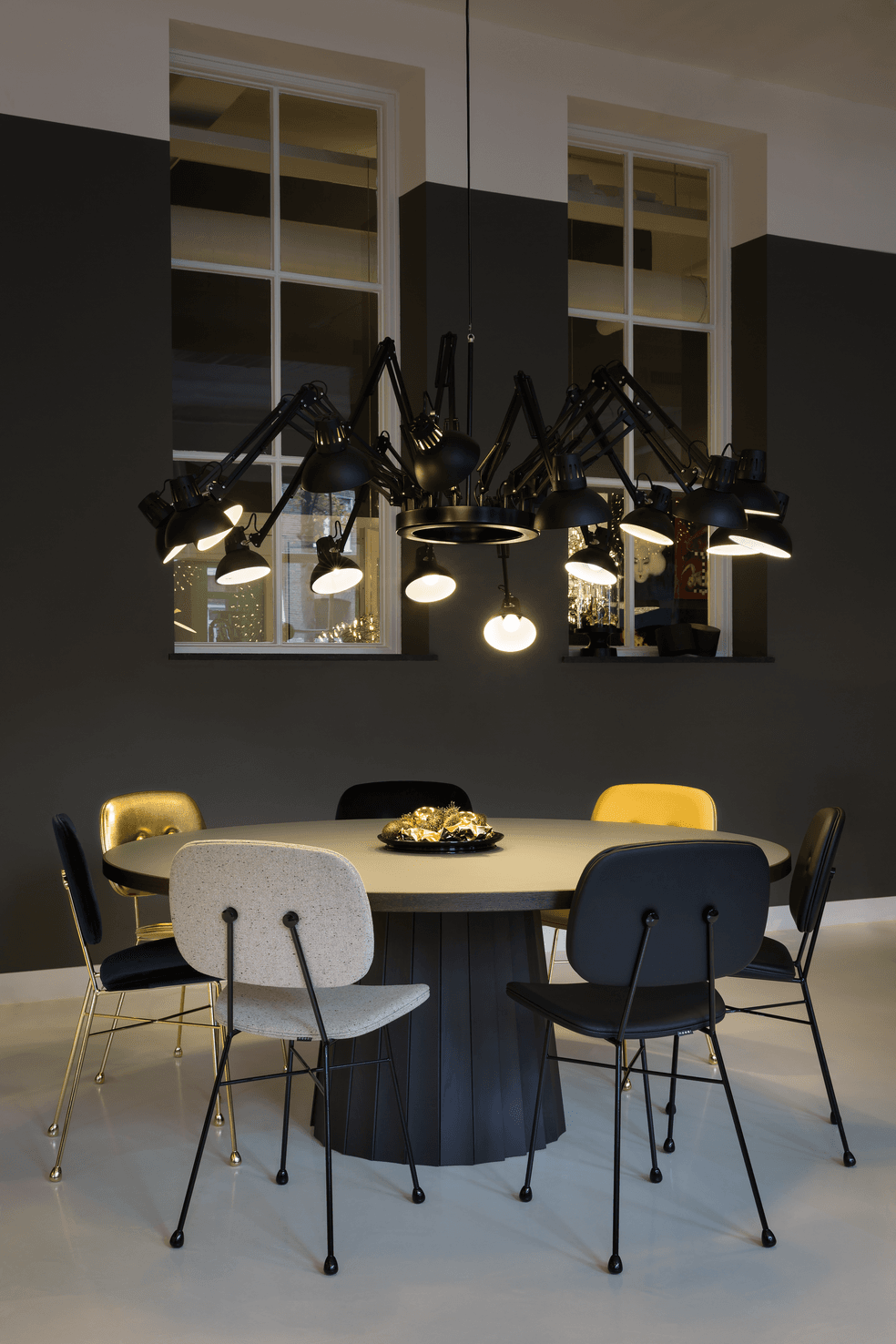 Interior of Amsterdam Showroom with Dear Ingo suspension light, Container Table and The Golden Chair