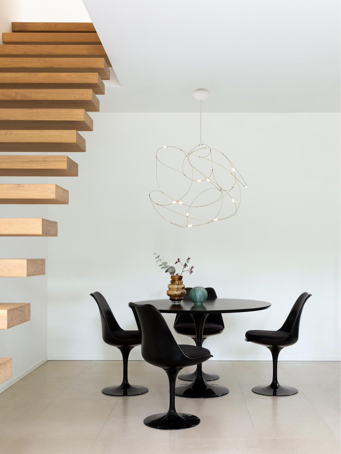 Interior with Flock of Light suspension light above dining table