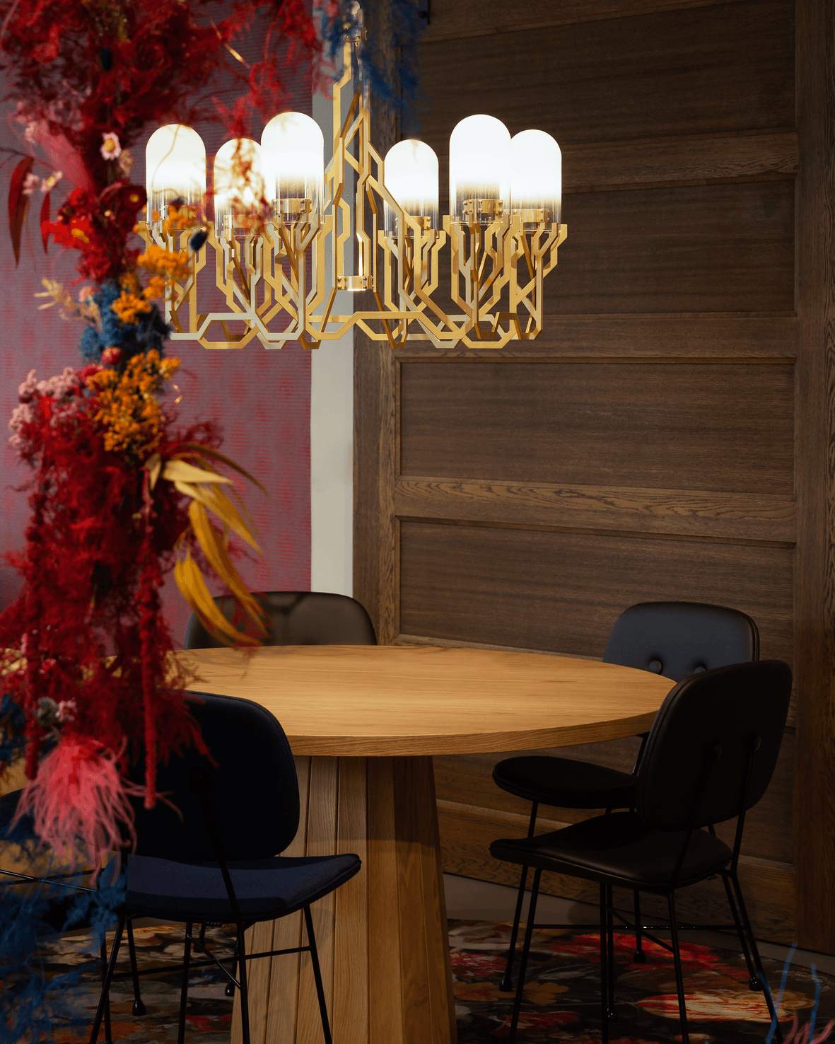 Interior of London Showroom with Plant Chandelier, Container Table and The Golden Chair with flowers