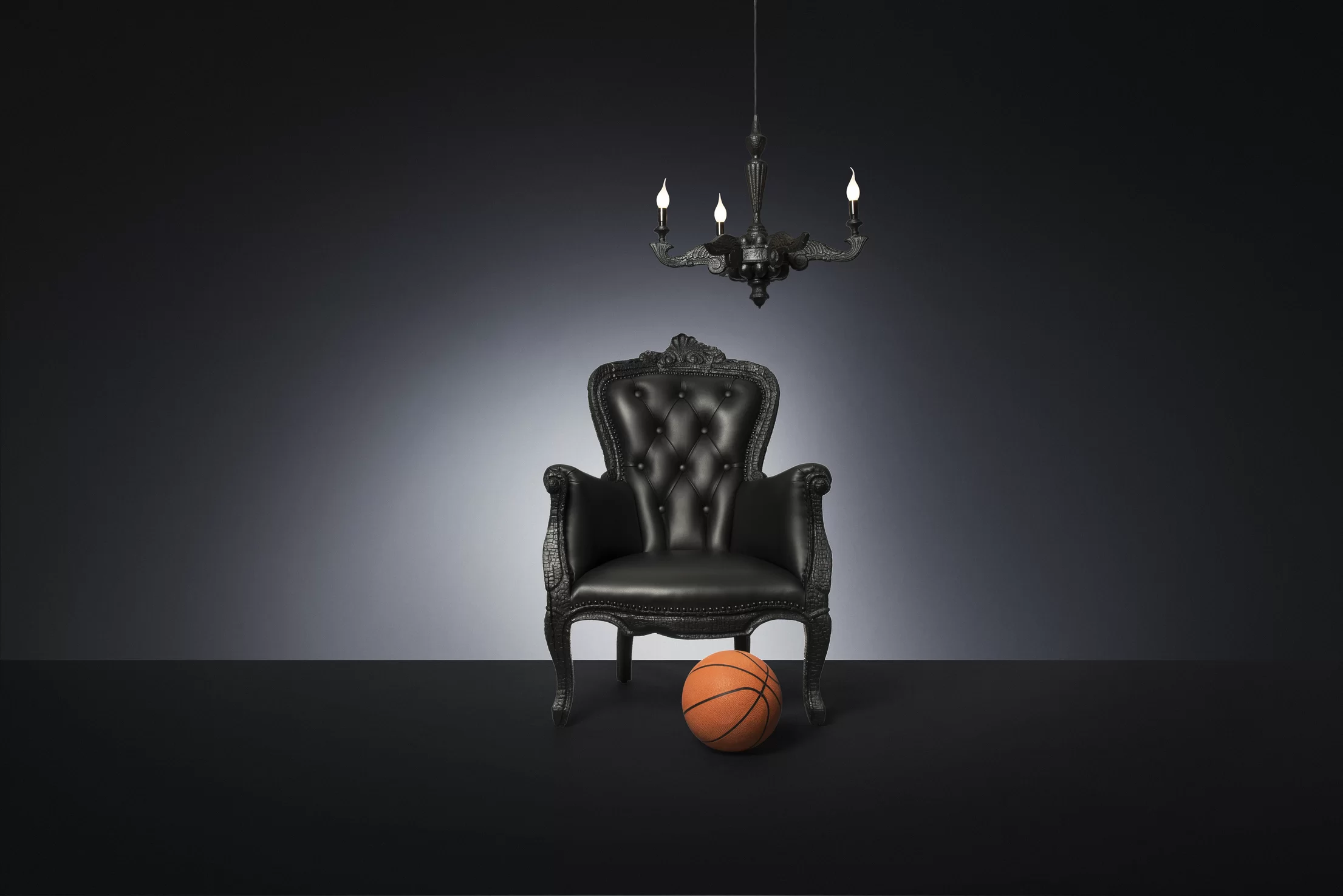 Poetic composition Smoke Armchair, Smoke Chandelier and a basketball