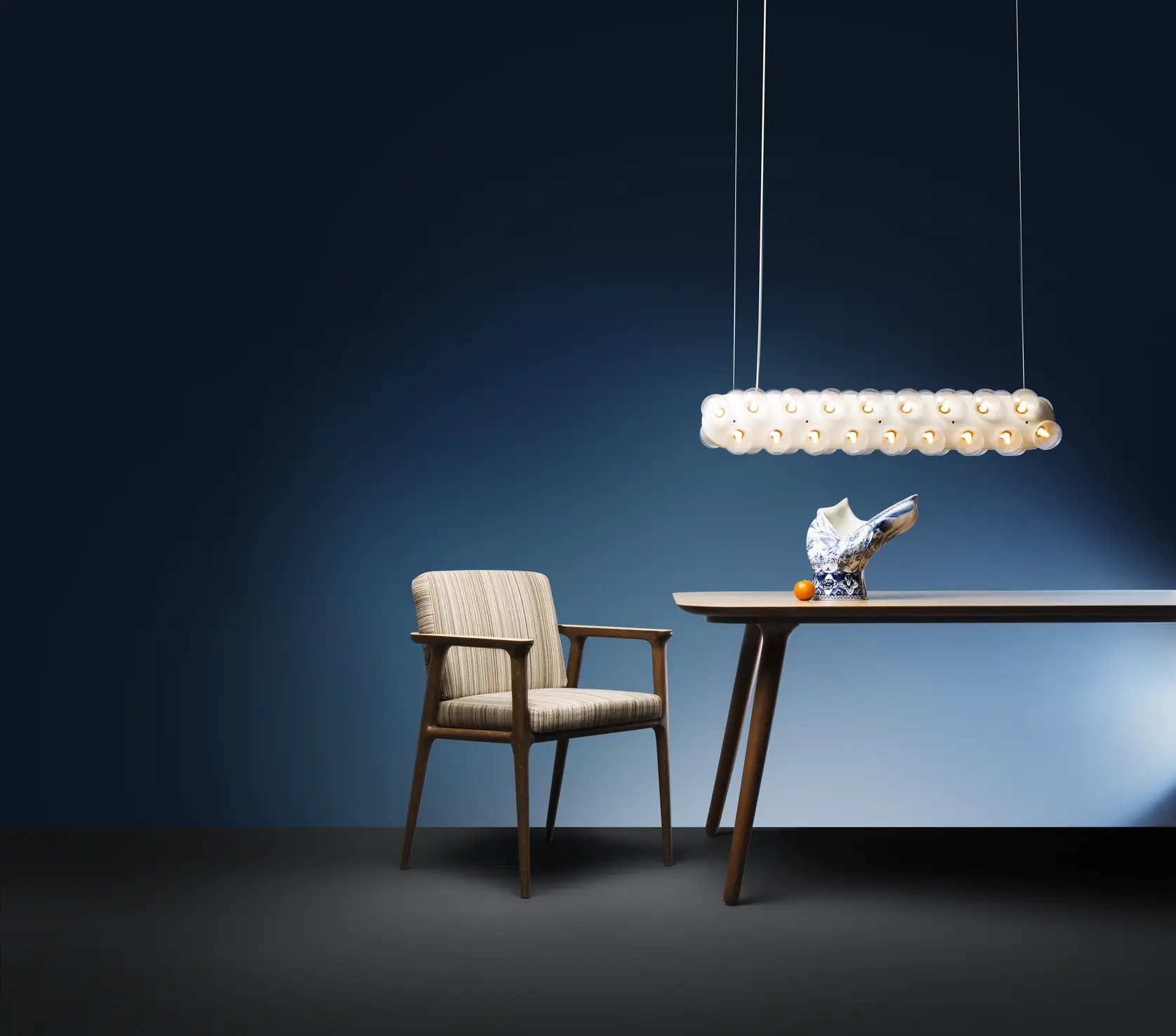 Poetic composition Zio Dining Chair, Zio Dining Table, Blow Away Vase and Prop Light suspension